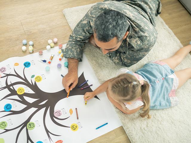 father and daughter filling out family tree picture