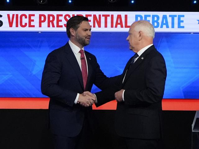 Republican vice presidential nominee Sen. JD Vance, R-Ohio, left, and Democratic vice presidential nominee Minnesota Gov. Tim Walz, meet at the CBS News vice presidential debate, Oct. 1, 2024, in New York. (AP Photo/Julia Demaree Nikhinson)