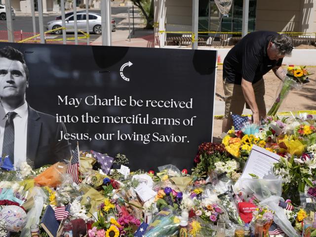 A makeshift memorial at Turning Point USA headquarters in Phoenix after the shooting death of Charlie Kirk, the 31-year-old founder and CEO of the group, Sept. 11, 2025. (AP Photo/Ross D. Franklin)