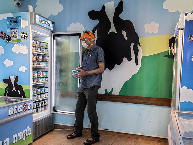 An Israeli shops at the Ben &amp; Jerry&#039;s ice-cream factory in the Be&#039;er Tuvia Industrial area, Tuesday, July 20, 2021. 