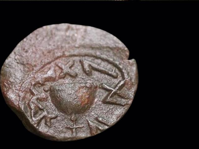 The front of a rare bronze coin minted by Jews in Jerusalem. Photo Credit: Emil Aladjem, Israel Antiquities Authority.