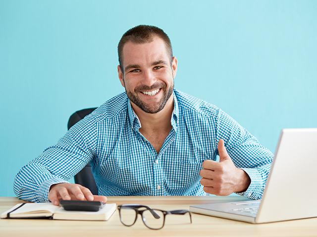 businessman smiling thumbs up