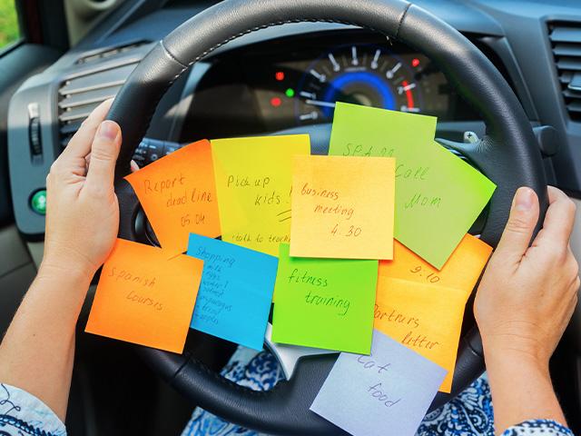 to do list sticky notes on car steering wheel