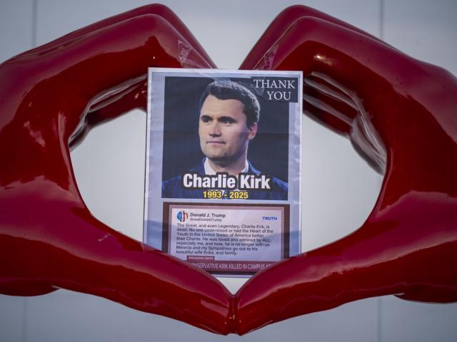 A picture of Charlie Kirk is placed at the &quot;Hands of Love&quot; art installation in Beverly Hills on Sept. 14, 2025. (Ringo Chiu via AP)