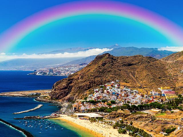 rainbow over a mountain coast 