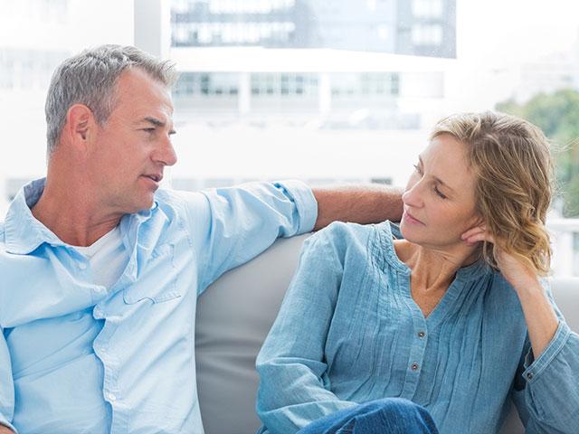 couple talking, relaxing on the couch