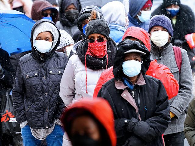 People wait in line at a 24-hour, walk-up COVID-19 vaccination clinic hosted by the Black Doctors COVID-19 Consortium at Temple University&#039;s Liacouras Center in Philadelphia. (AP Photo/Matt Rourke, File)