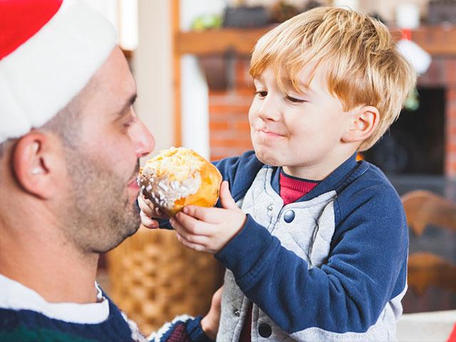 Dad eating cake at Christmas