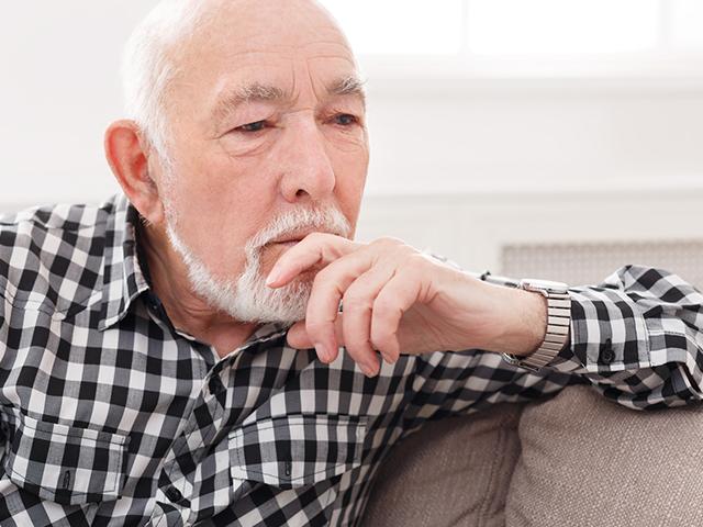 pensive elderly man