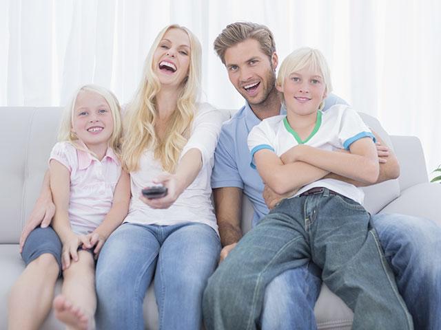 Family watching television together