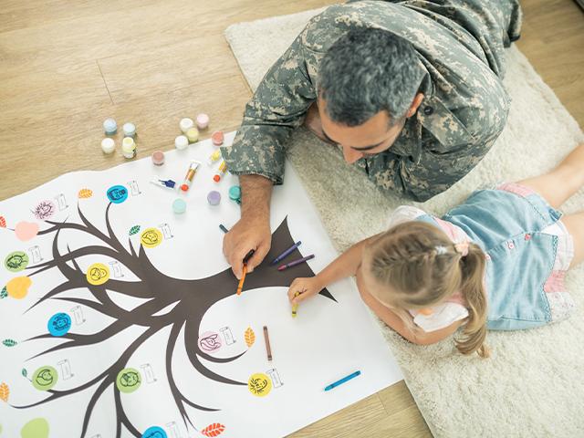 father and daughter filling out family tree picture