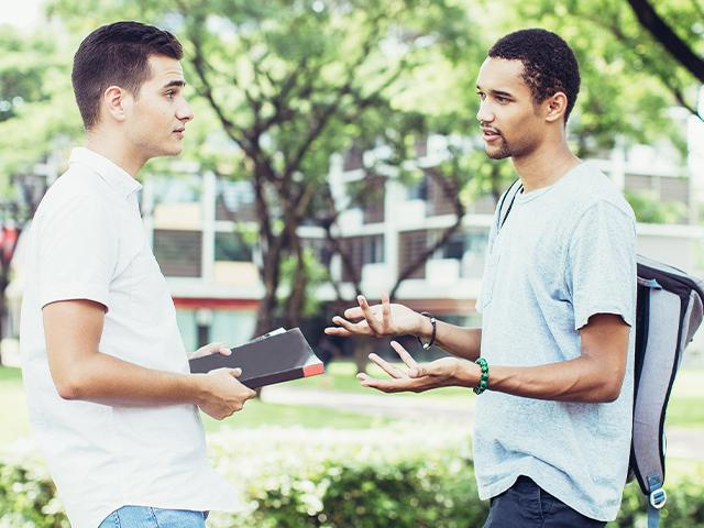 two friends talking outside