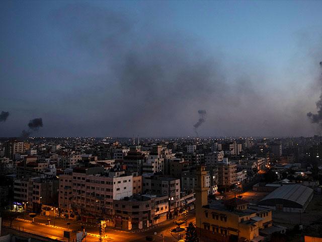 Black smoke rise following Israeli airstrikes on Gaza City, Wednesday, May 12, 2021. (AP Photo/Khalil Hamra)