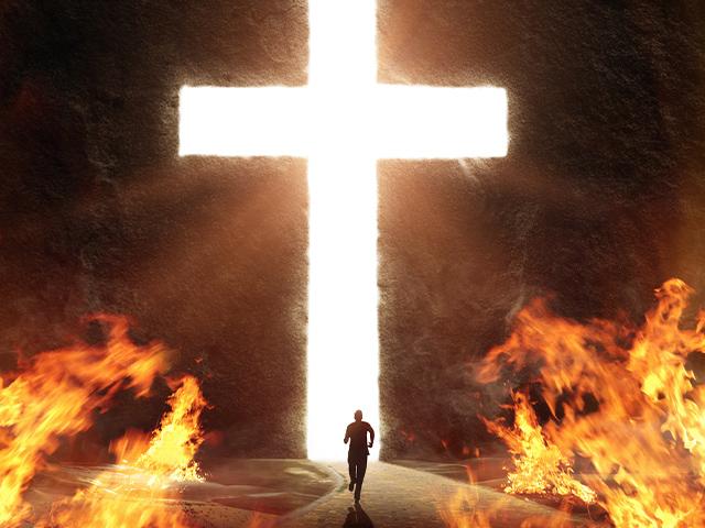 person running away from flames toward giant bright white cross shaped opening