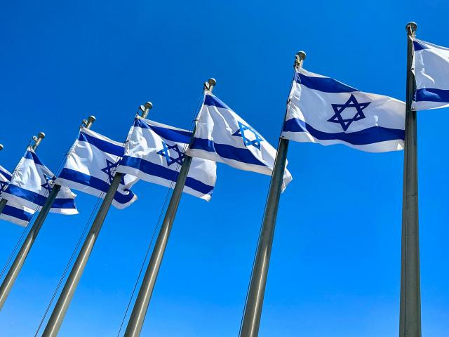 Flags flying in front of the Israeli Knesset. Photo Credit: CBN News.