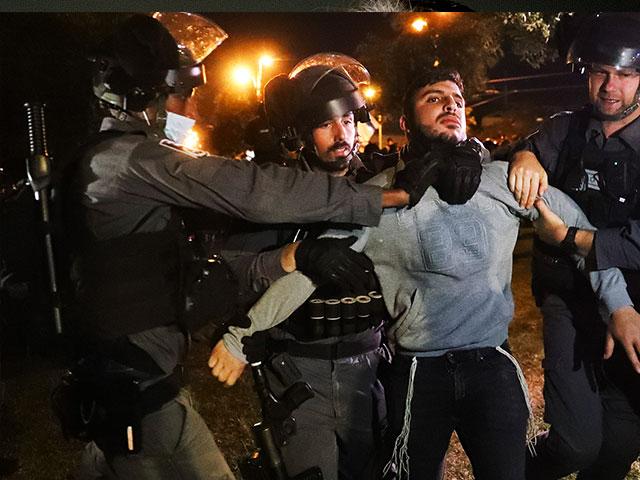 Israeli border police detain an Israeli youth as members of a Jewish extremist group try approach to Damascus Gate to protest amid heightened tensions in Jerusalem. Thursday, April. 22, 2021. (AP Photo/Ariel Schalit)