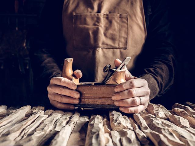 man using a wood tool