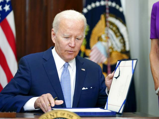 President Joe Biden signs into law S. 2938, the Bipartisan Safer Communities Act gun safety bill, in the Roosevelt Room of the White House in Washington, Saturday, June 25, 2022. (AP Photo/Pablo Martinez Monsivais)