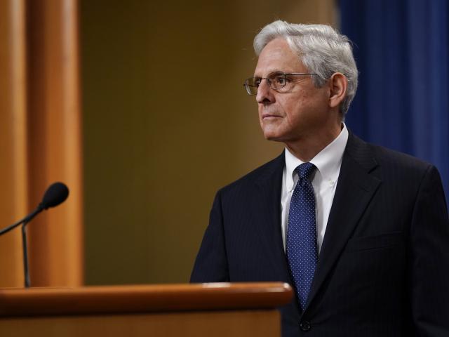 Attorney General Merrick Garland listens to a question as he leaves the podium after speaking at the Justice Department Thursday, Aug. 11, 2022