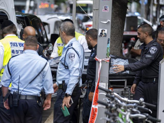 Israeli police remove the body of Palestinian Musa Sarsour after he allegedly killed an 84-year-old Israeli woman and then hung himself, in Tel Aviv, Israel, Wednesday, Sept. 21, 2022. (AP Photo)