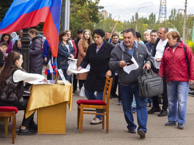 People line up to vote in a referendum in Luhansk, Luhansk People&#039;s Republic controlled by Russia-backed separatists, eastern Ukraine, Sept. 24, 2022. 