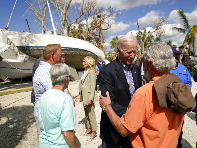 President Joe Biden and first lady Jill Biden talk to people impacted by Hurricane Ian during a tour of the area on Wednesday, Oct. 5, 2022, in Fort Myers Beach, Fla. (AP Photo/Evan Vucci)