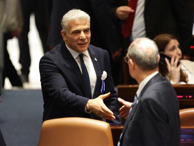 Israeli outgoing Prime Minister Yair Lapid is seen during the swearing-in ceremony for Israeli lawmakers at the Knesset, Israel&#039;s parliament, in Jerusalem, Tuesday, Nov. 15, 2022. (Abir Sultan/Pool Photo via AP)