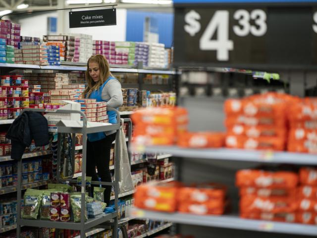 A worker organizes items at a Walmart Supercenter in North Bergen, N.J., on Thursday, Feb. 9, 2023. On Tuesday, the Labor Department reports on U.S. consumer prices for February. (AP Photo/Eduardo Munoz Alvarez)