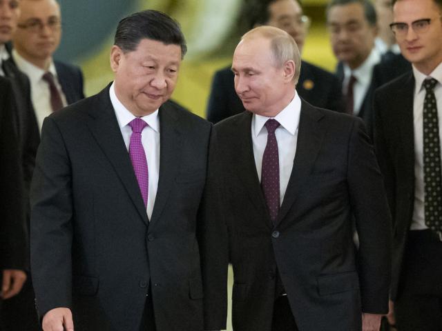 Chinese President Xi Jinping, left, and Russian President Vladimir Putin enter a hall for talks in the Kremlin in Moscow, Russia, June 5, 2019. (AP Photo/Alexander Zemlianichenko, Pool, File)