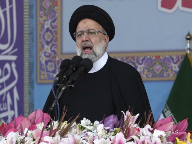 Iranian President Ebrahim Raisi speaks during during Army Day parade in front of the mausoleum of the late revolutionary founder Ayatollah Khomeini just outside Tehran, Iran, Tuesday, April 18, 2023. (AP Photo/Vahid Salemi)