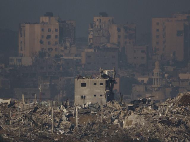 Destroyed buildings are seen in the Gaza Strip, as seen from southern Israel, Monday, Nov. 20, 2023. (AP Photo/Leo Correa)