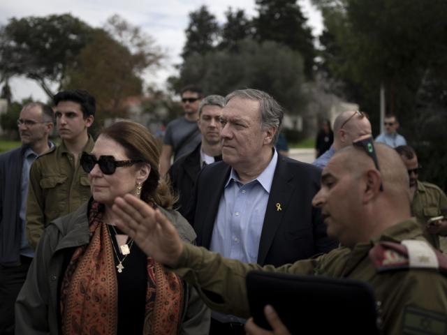 Former U.S. Secretary of State Mike Pompeo and his wife, Susan tour Kibbutz Kfar Azza, southern Israel, near the Gaza border, Tuesday, Feb. 13, 2024, the site of a cross-border attack by Hamas on Oct. 7, 2023. (AP Photo/Maya Alleruzzo)