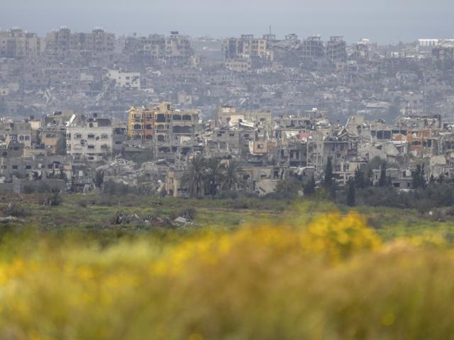 Israel Palestinians Destroyed buildings stand in the Gaza Strip as seen from southern Israel, Monday, March 18, 2024. (AP Photo/Ohad Zwigenberg)