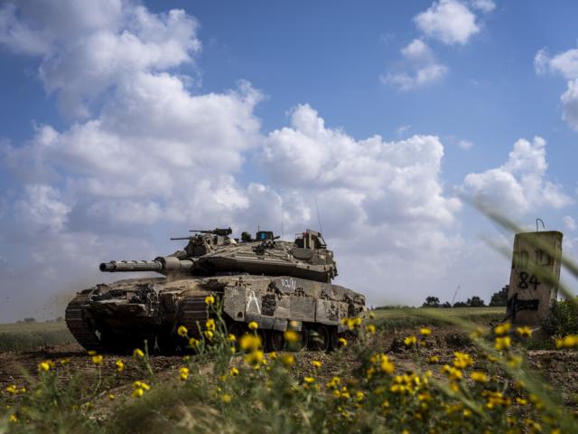 Israeli soldiers drive a tank on the border with Gaza Strip, in southern Israel, Tuesday, March 19, 2024. The army is battling Palestinian militants across Gaza in the war ignited by Hamas&#039; Oct. 7 attack into Israel. (AP Photo/Ariel Schalit)