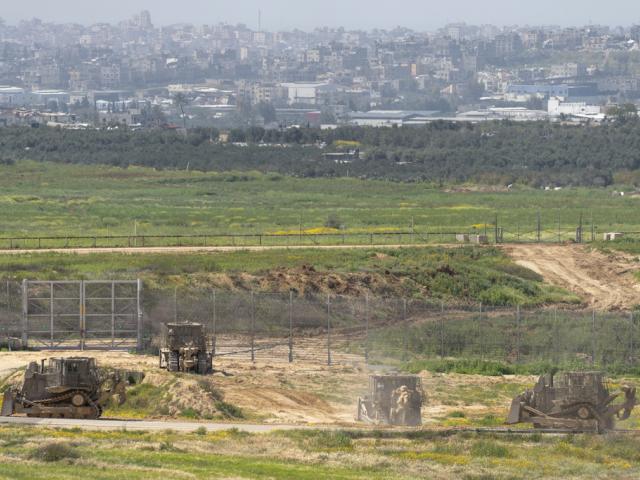 Israeli army bulldozers are seen near the Gaza Strip border, in southern Israel, Thursday, March 21, 2024. (AP Photo/Ohad Zwigenberg)