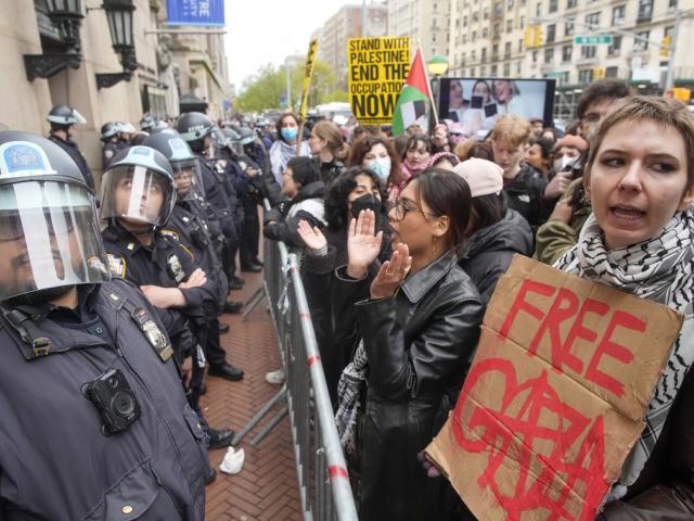 - Police in Riot gear stand guard as demonstrators chant slogans outside the Columbia University campus, Thursday, April 18, 2024, in New York. (AP Photo/Mary Altaffer, File)