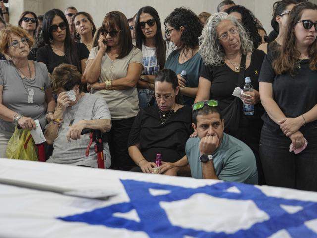 Mourners attend the funeral of Michel Nisenbaum, who was killed during Ham