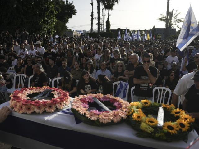 Israelis attend the funeral of Hanan Yablonka, who was killed during Hamas&#039; Oct. 7, 2023 attack and whose body was taken into Gaza, during his funeral in Tel Aviv, Israel, on Sunday, May 26, 2024. (AP Photo/Oded Balilty)