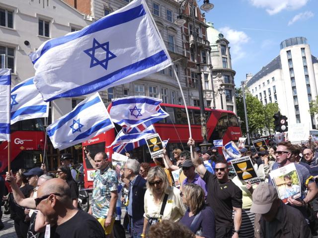 People take part in a Bring Hostages Home event in central London, Sunday, June 2, 2024, to demand the immediate release of Israeli hostages from Gaza. (Lucy North/PA via AP)