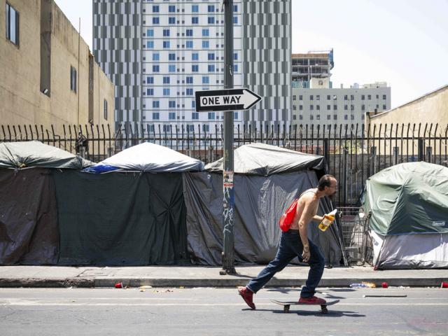 Homeless tents are lined up on Skid Row, July 25, 2024, in Los Angeles.  (Sarah Reingewirtz/The Orange County Register via AP)