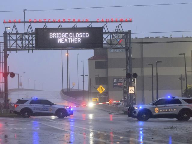 The entrance to Lake Ponchartrain Causeway is closed due to Hurricane Francine in Metairie, La., Wednesday, Sept. 11, 2024. The causeway is the longest continuous bridge over water in the world. (AP Photo/Matthew Hinton)