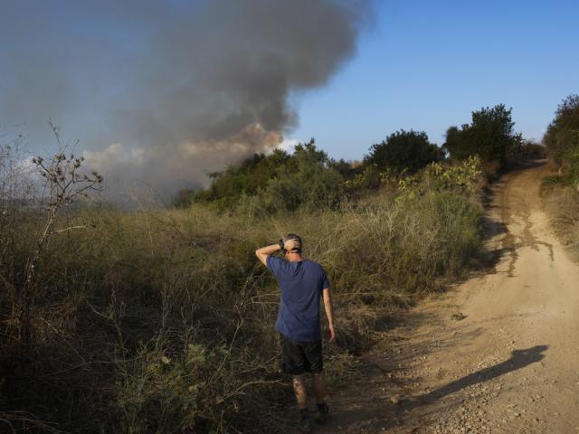 Smoke rises from a fire in central Israel after the Israeli army said a missile fired from Yemen landed in an open area on Sunday, Sept. 15, 2024. (AP Photo/Ohad Zwigenberg)