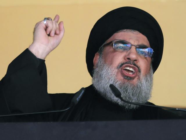 In this Oct. 24, 2015 file photo, Hezbollah leader Sheik Hassan Nasrallah addresses a crowd during the holy day of Ashoura, in a southern suburb of Beirut, Lebanon. (AP Photo/Hassan Ammar, File)