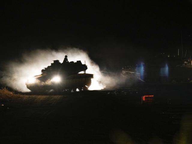 An Israeli tank maneuvers in northern Israel near the Israel-Lebanon border, Monday, Sept. 30, 2024. (AP Photo/Baz Ratner)