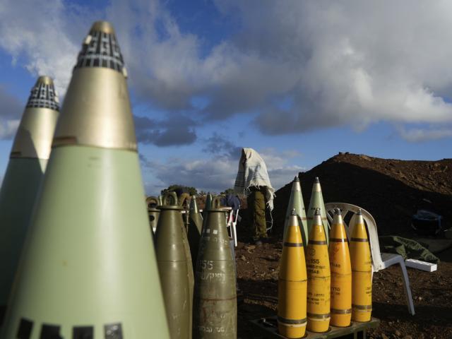 An Israeli soldier covered in a prayer shawl prays at a mobile artillery position in northern Israel, Wednesday, Oct. 2, 2024. (AP Photo/Baz Ratner)