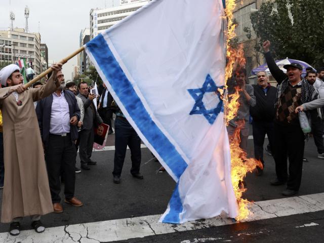 Iranian demonstrators burn a representation of the Israeli flag in an annual rally in front of the former U.S. Embassy in Tehran, Iran, Sunday, Nov. 3, 2024, marking the 45th anniversary of Iran&#039;s takeover of the embassy. (AP photo/Vahid Salemi)