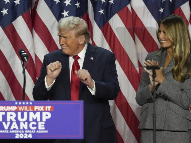 Republican President-Elect Donald Trump dances as Melania Trump watches at the Palm Beach County Convention Center during an election night watch party, Wednesday, Nov. 6, 2024, in West Palm Beach, Fla. (AP Photo/Lynne Sladky)