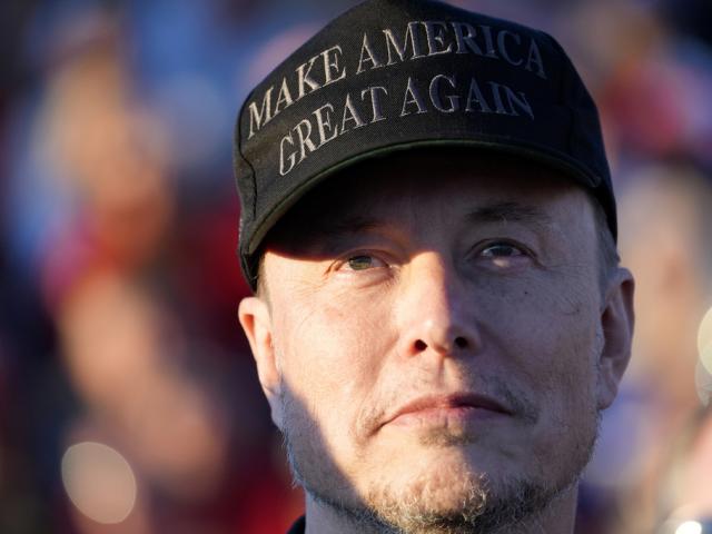 Tesla and SpaceX CEO Elon Musk listens as Republican presidential nominee former President Donald Trump speaks at a campaign event at the Butler Farm Show, Oct. 5, 2024, in Butler, Pa. (AP Photo/Alex Brandon, File)