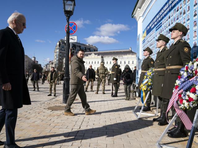 US President Joe Biden, left, participates in a wreath laying ceremony with Ukrainian President Volodymyr Zelenskyy at the memorial wall outside of St. Michael&#039;s Golden-Domed Cathedral, in Kyiv, Ukraine, Monday, Feb. 20, 2023. (AP Photo/Evan Vucci, File)