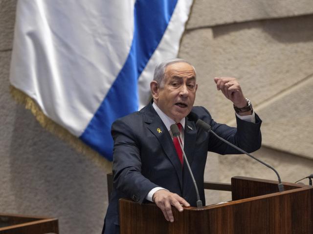 Israel&#039;s Prime Minister Benjamin Netanyahu addresses lawmakers in the Knesset, Israel&#039;s parliament, in Jerusalem. Monday Nov. 18, 2024. (AP Photo/Ohad Zwigenberg, File)